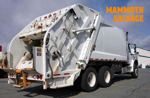 Photo of a white waste truck with a graphical overlay of text saying MAMMOTH SALVAGE