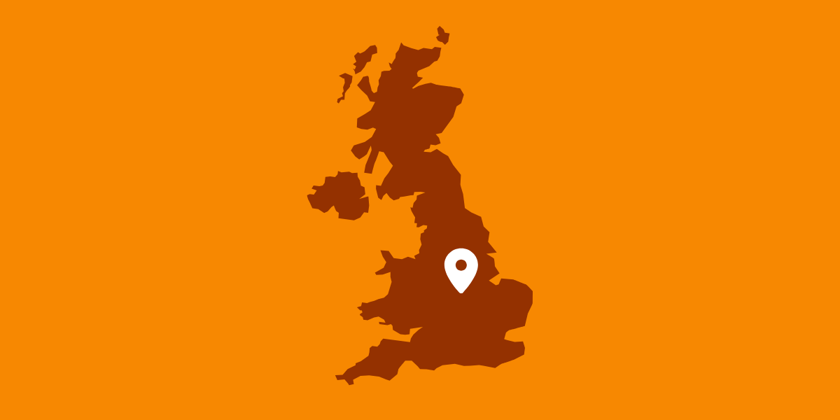 Graphic of a brown UK map and a white map marker over Leicester with an orange background